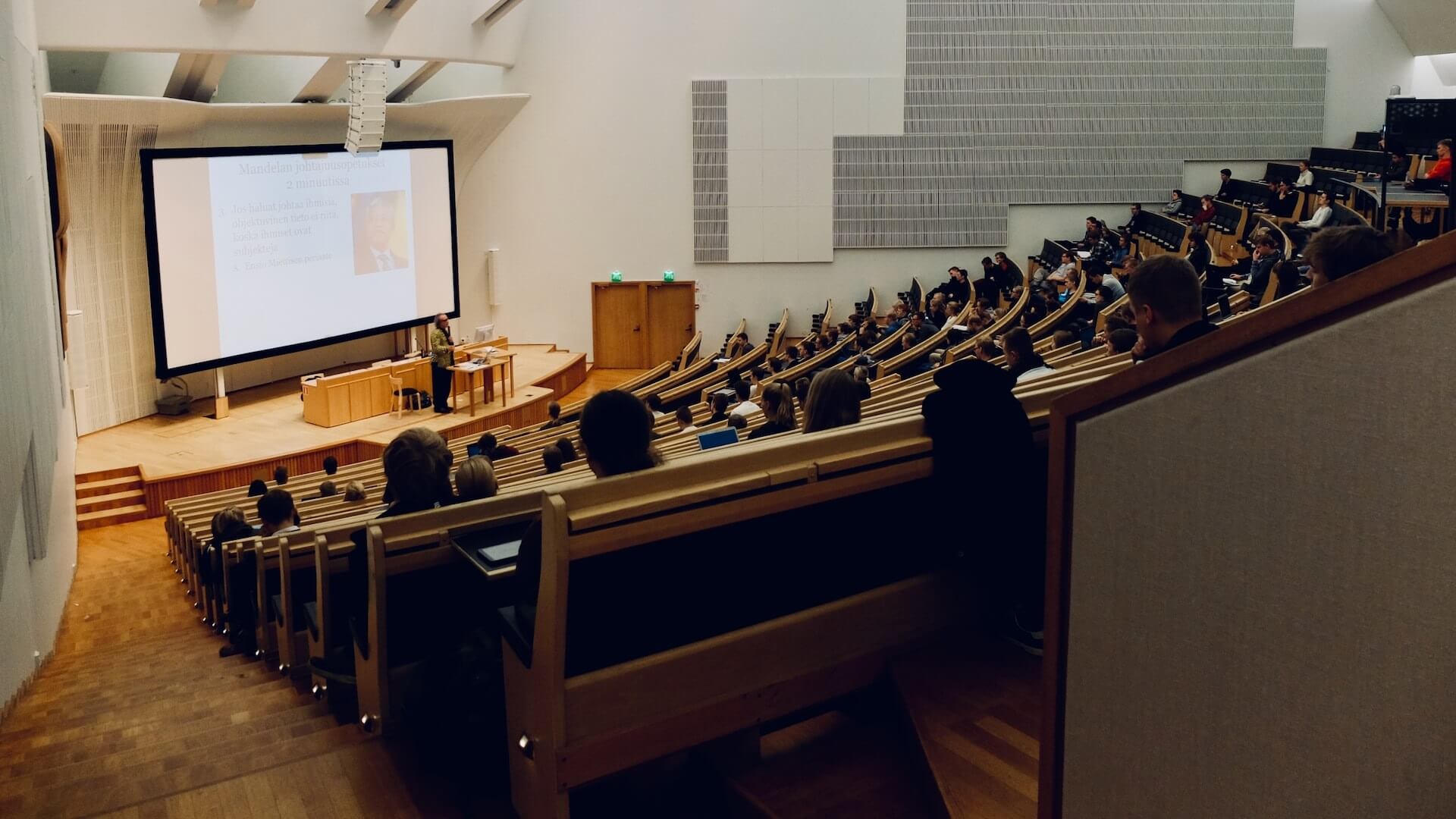 Students gather in a lecture hall