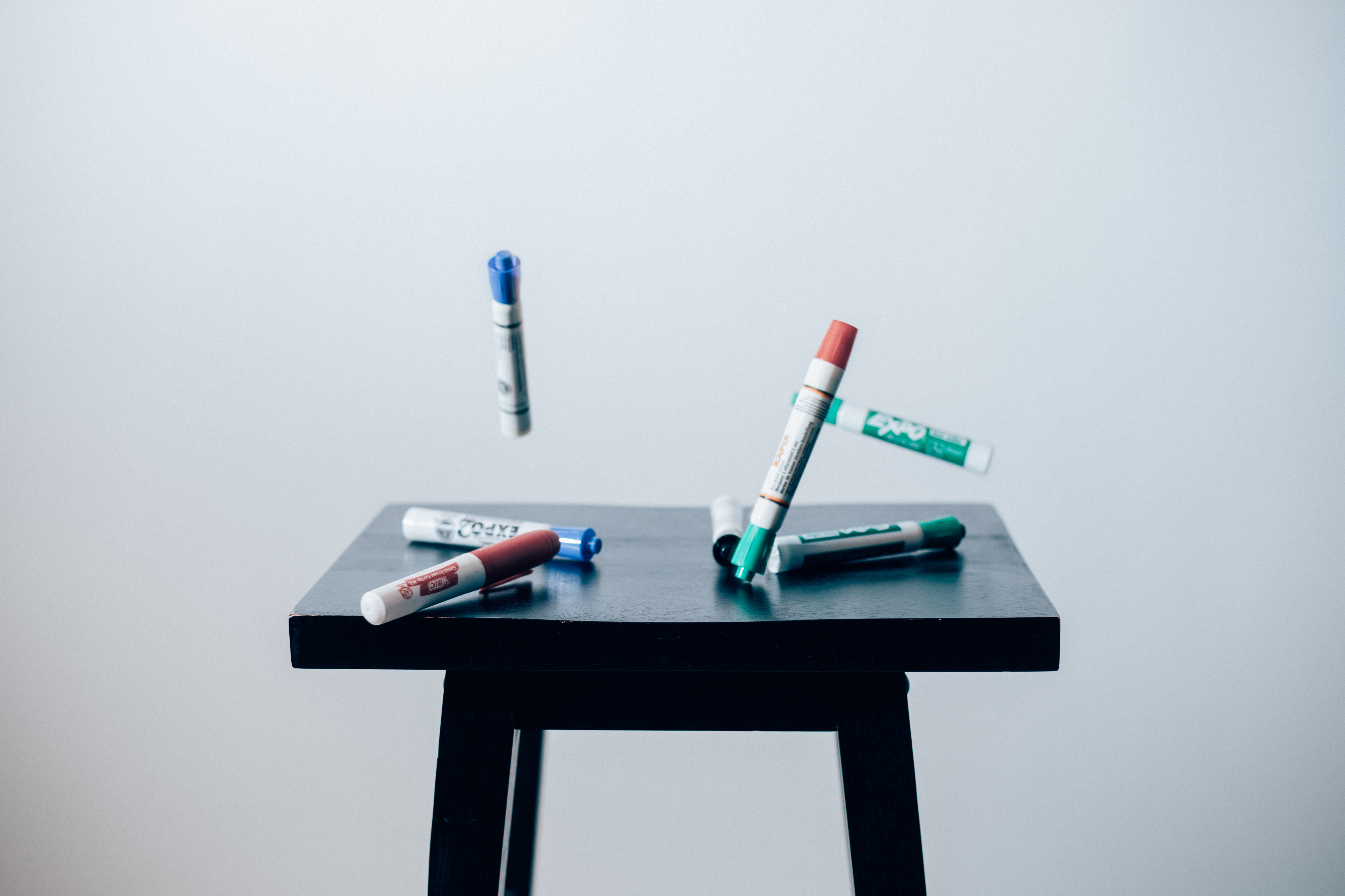 Markers fall onto a nightstand