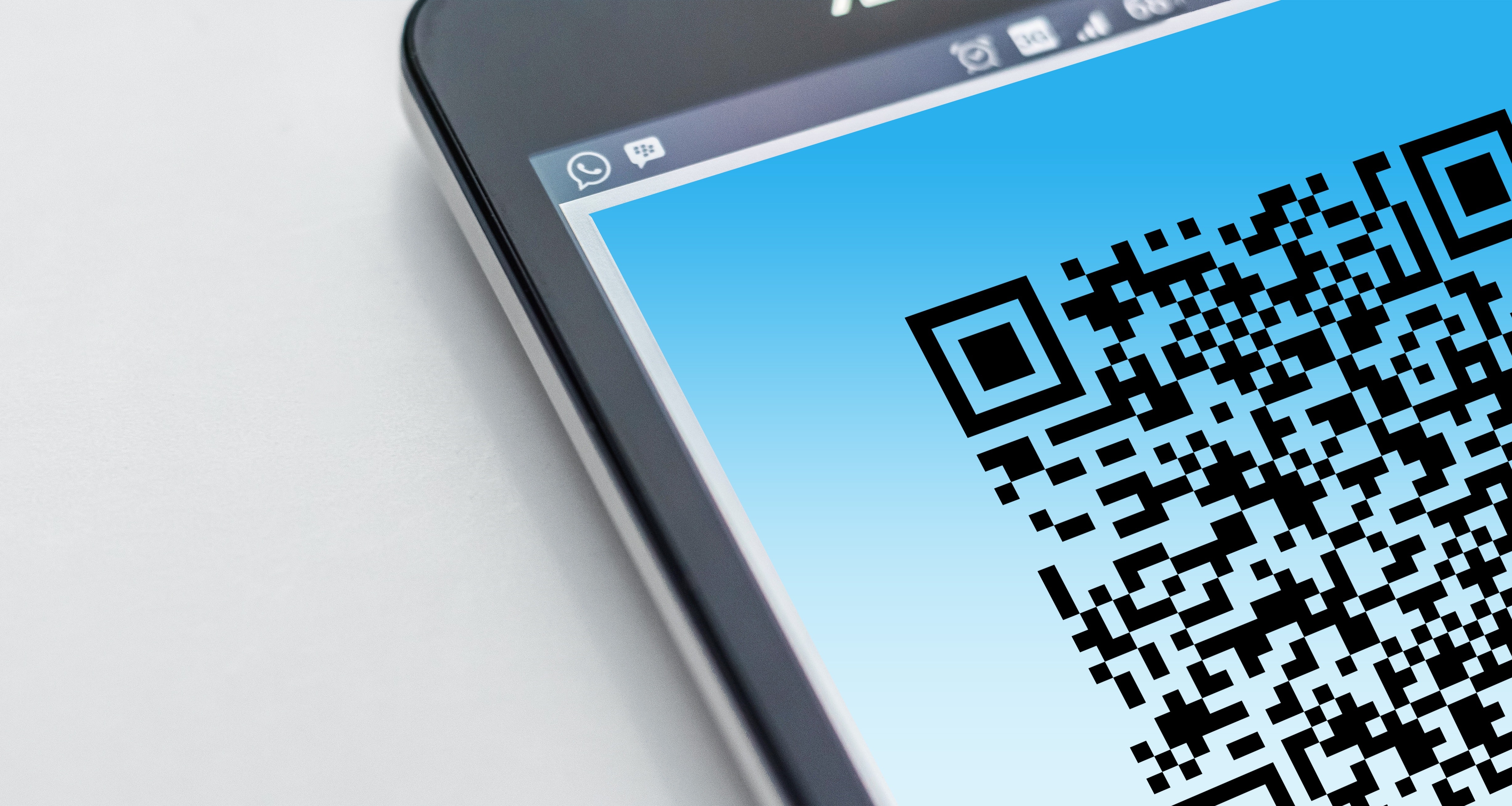A QR code shows on a mobile screen